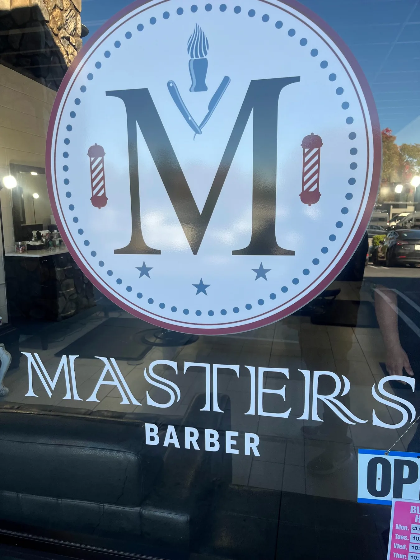 Masters Barber logo displayed on the shop window